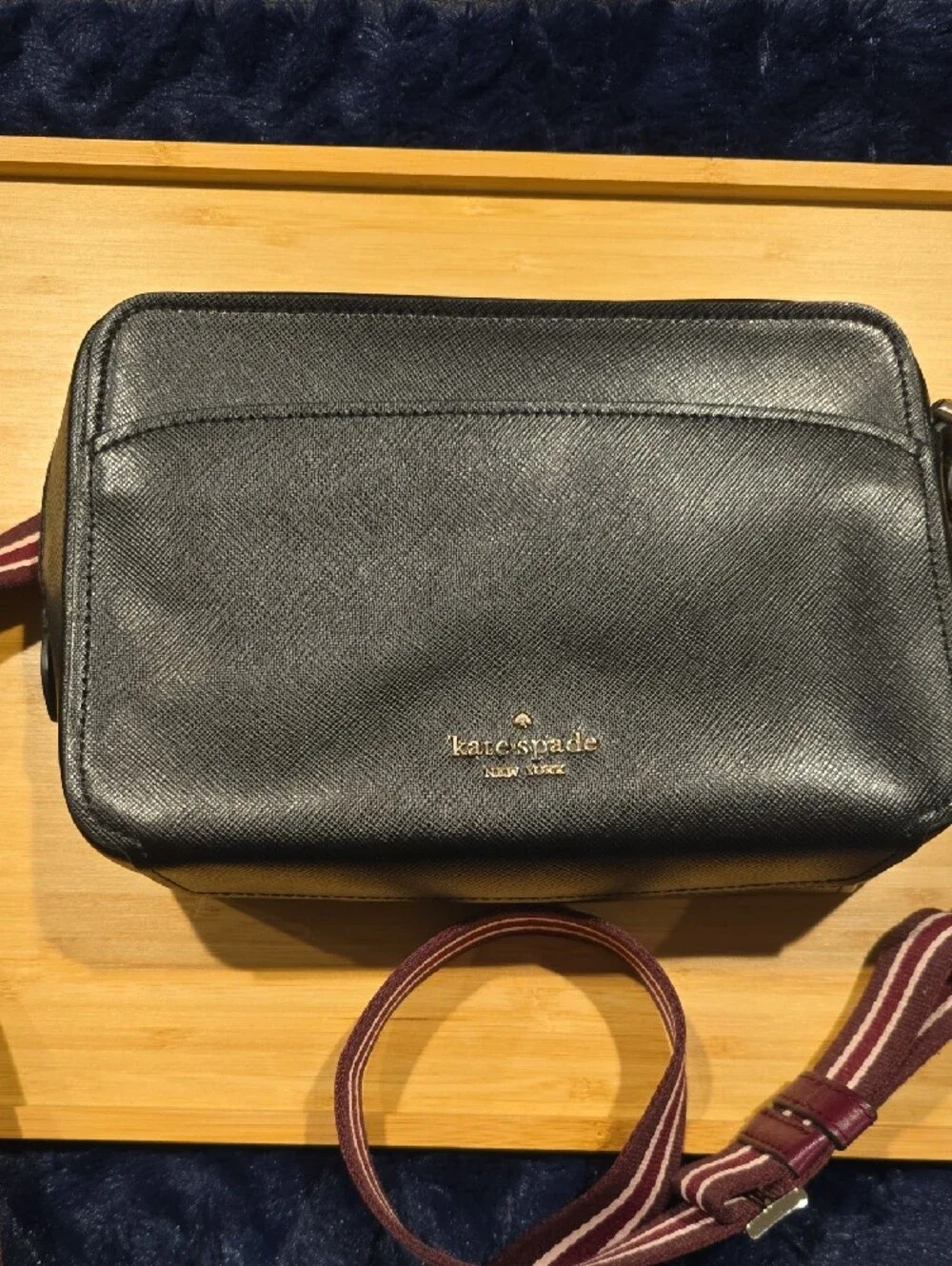 kate spade Lauryn black leather camera bag with burgundy striped strap